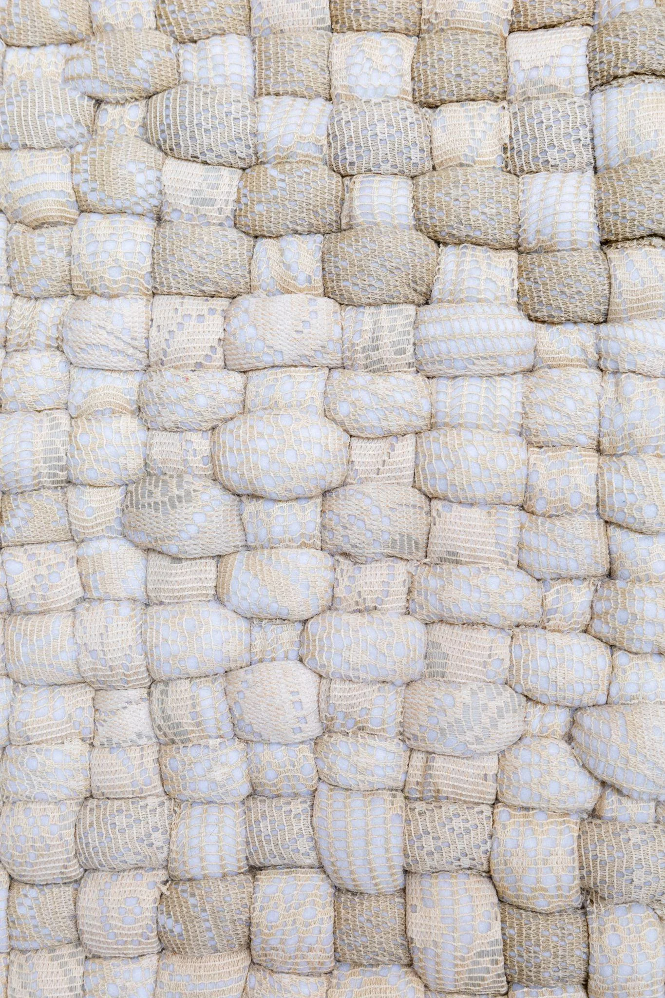 White woven forms and threads in a textile detail