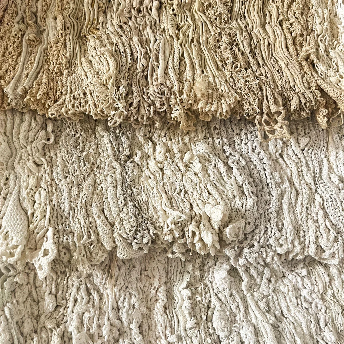 Close detail of loose and looped textile fibres