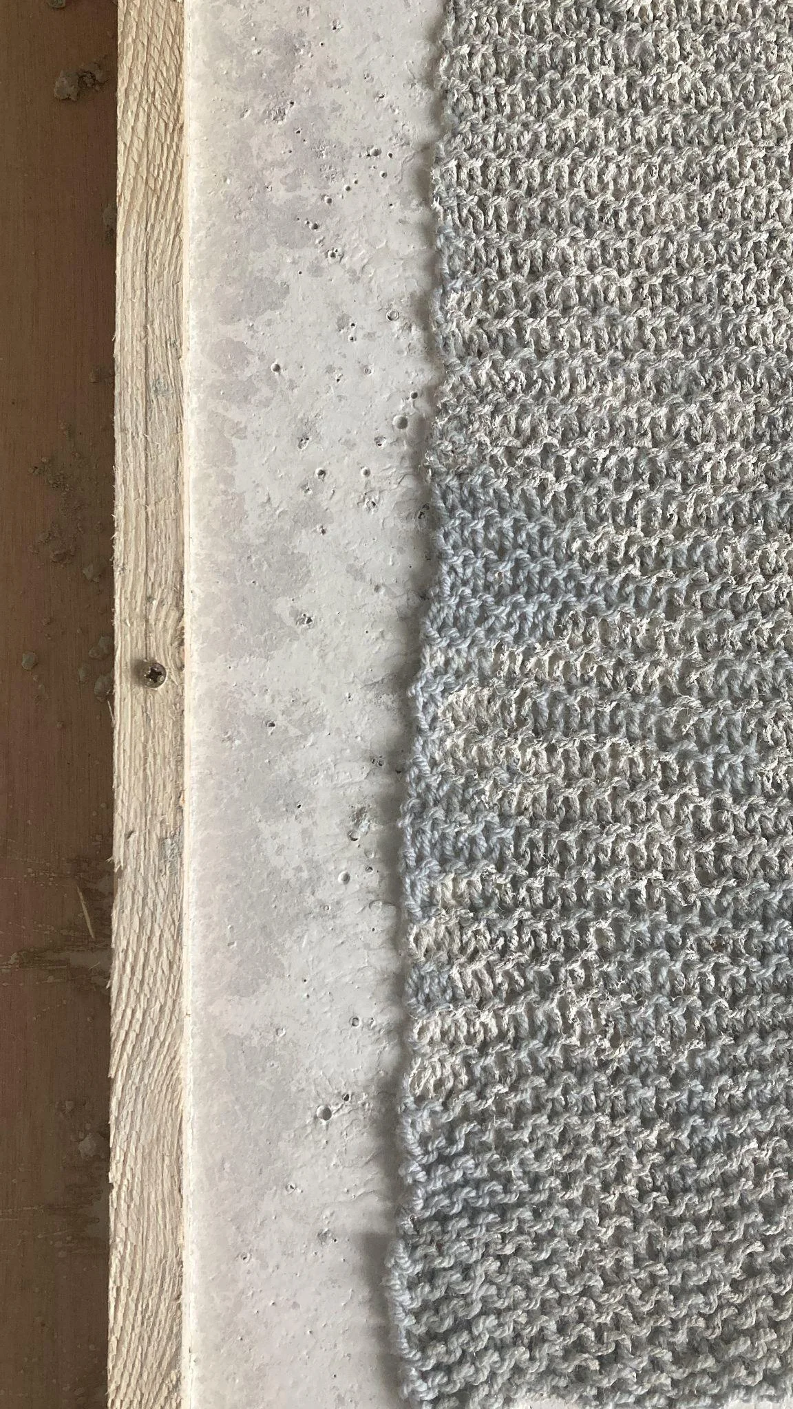 Close view of a grey textured sculptural surface