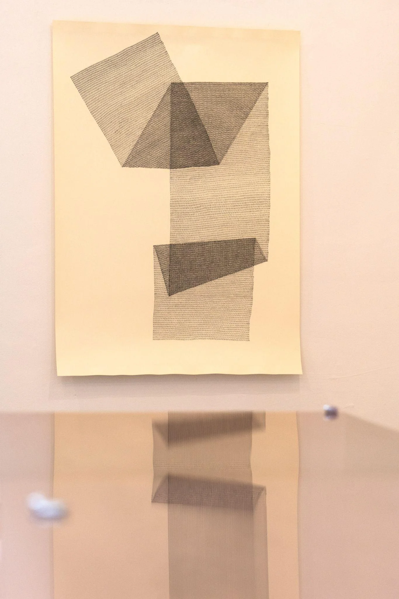 Geometric drawing and sculptural support in an exhibition