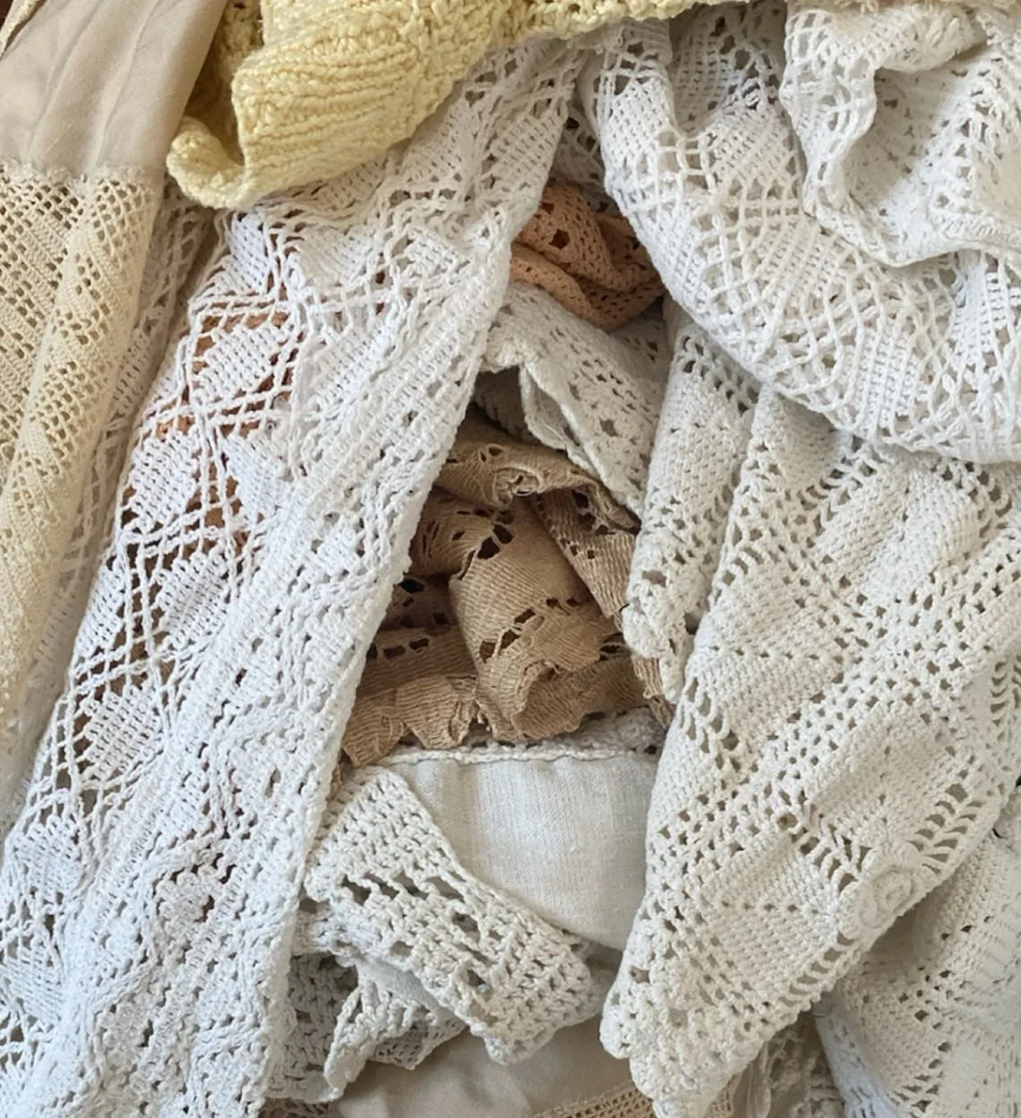 Folded white lace with open patterns and scalloped edges