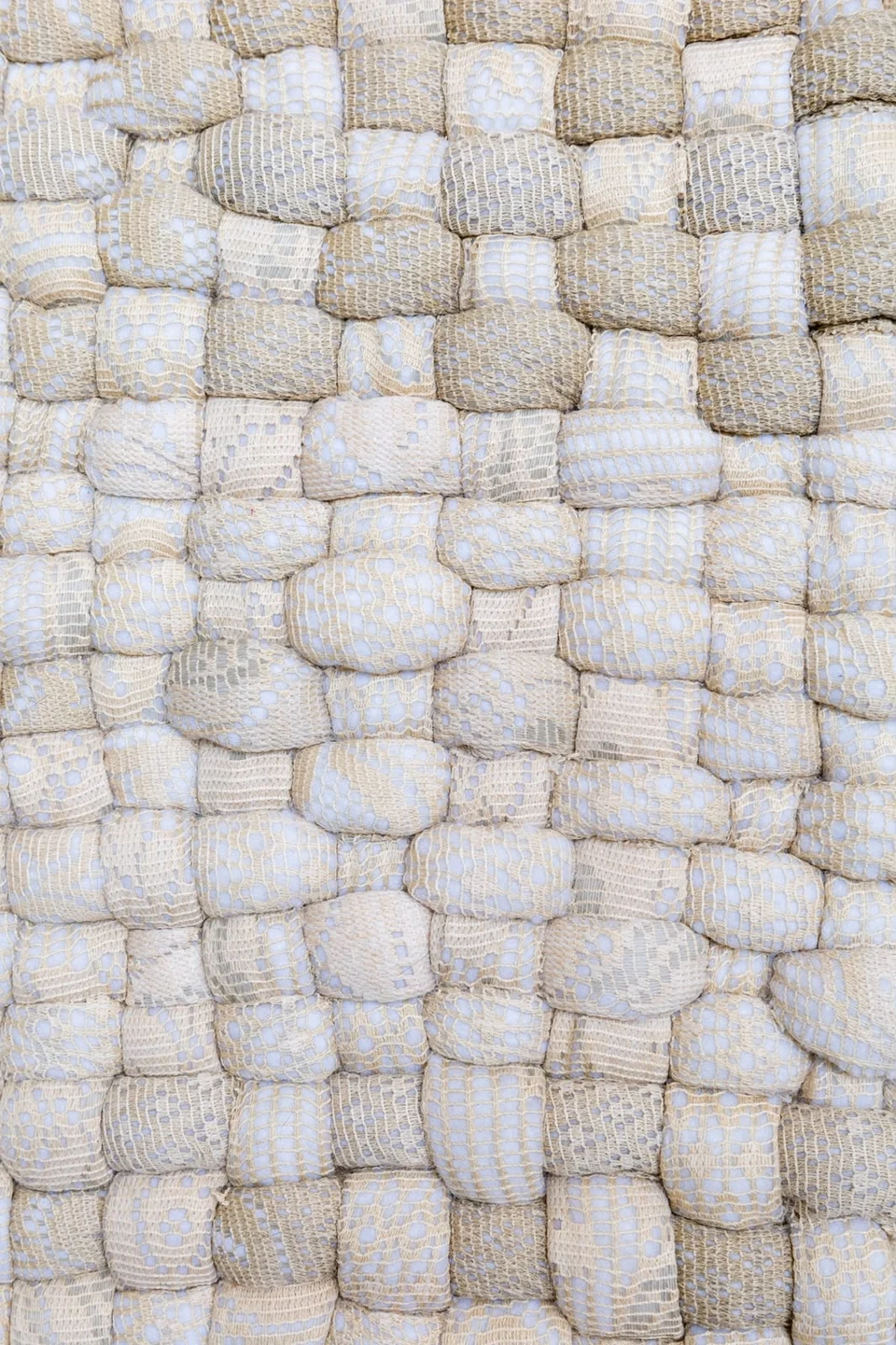 Detail of Echoes showing reclaimed curtain fabric wrapped around interlocking padded forms