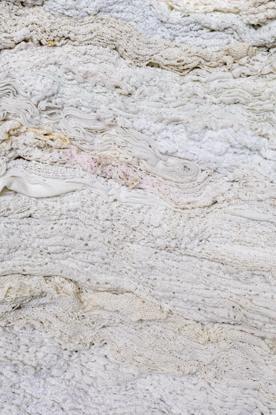 Detail of Erosion showing layered lace, Semadaki fabrics and thread
