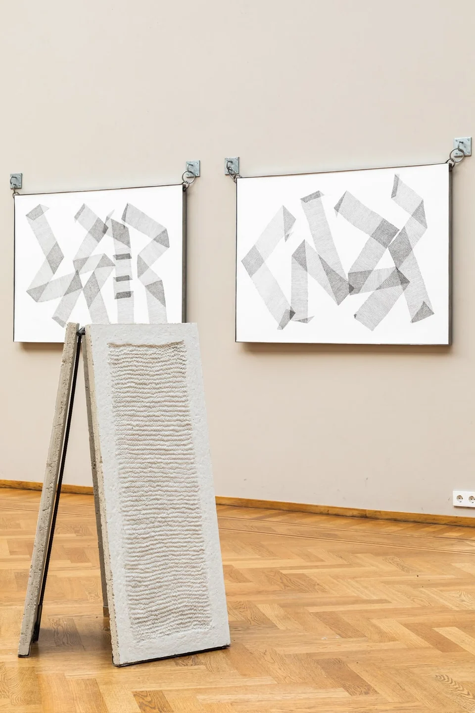 Fossil by Hara Athanasopoulou, a freestanding concrete and steel sculpture displayed in a gallery