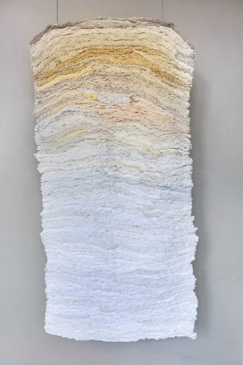 Erosion by Hara Athanasopoulou, full suspended textile in cream, sand and white