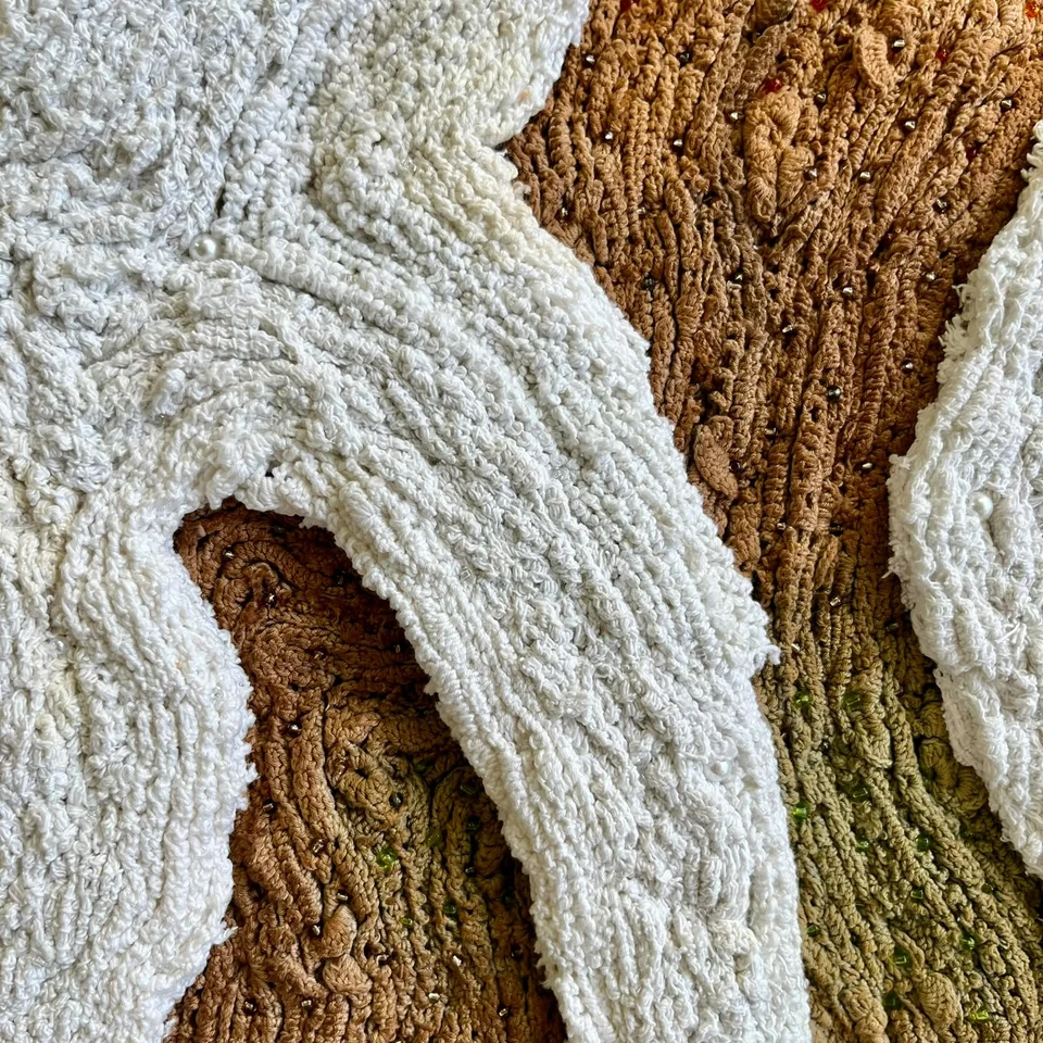 Detail of Soft Chamber showing layered white lace, naturally coloured fibres and beads